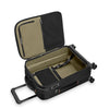 Black Briggs & Riley suitcase with open lid on a white background