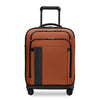 Orange Briggs & Riley suitcase with black accents on a white background