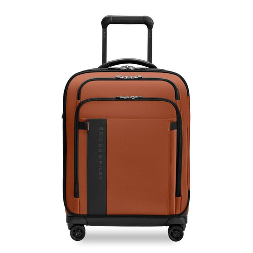 Orange Briggs & Riley suitcase with black accents on a white background