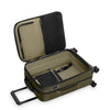 Open green Briggs & Riley suitcase on a white background