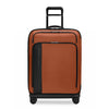 Orange Briggs & Riley suitcase with black accents on white background