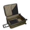 inside of green Briggs & Riley suitcase on a white background