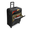 black Briggs & Riley suitcase with front pockets packed on a white background