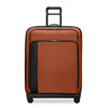 orange Briggs & Riley suitcase on a white background