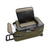 Green Briggs & Riley suitcase with open lid on a white background