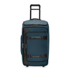 Blue Briggs & Riley suitcase with black accents on a white background