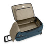 Open blue Briggs & Riley suitcase with beige interior on a white background