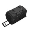 Black Briggs & Riley suitcase with handle and wheels on a white background