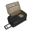 Black Briggs & Riley suitcase with open lid showing beige interior on a white background