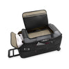 Black Briggs & Riley suitcase with open lid on a white background