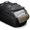 Black Briggs & Riley suitcase with open compartment showing white and beige items on a white background