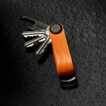 on table tangerine Orbitkey Active Key Organizer