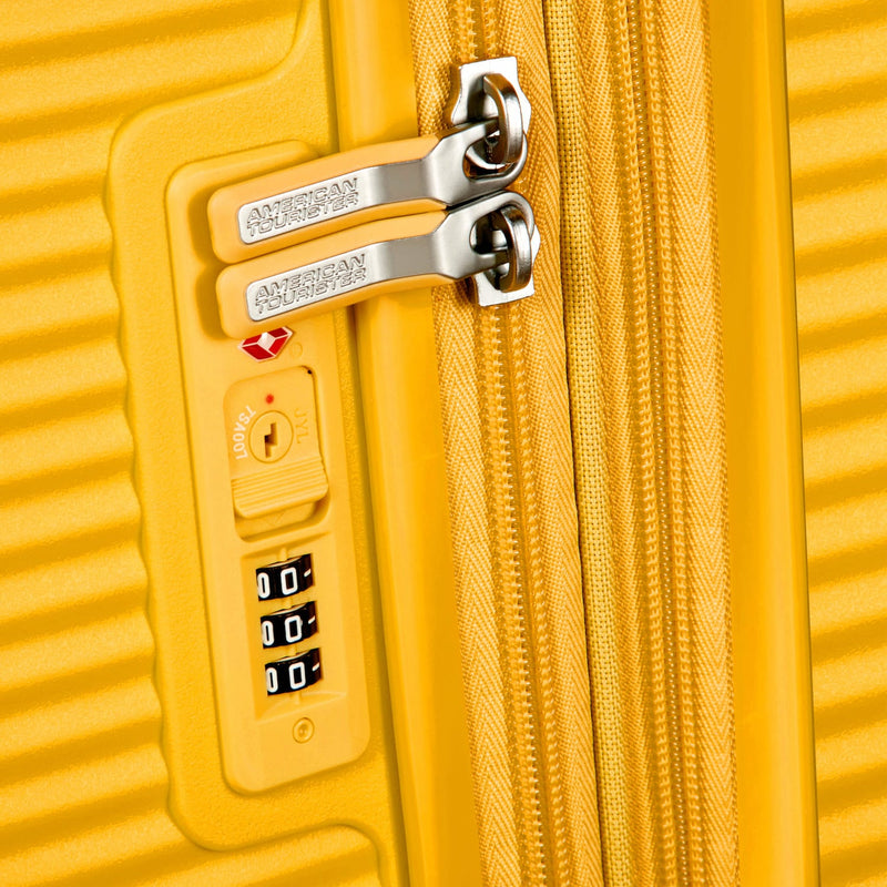 TSA lock of golden yellow American Tourister Curio Spinner Carry-On