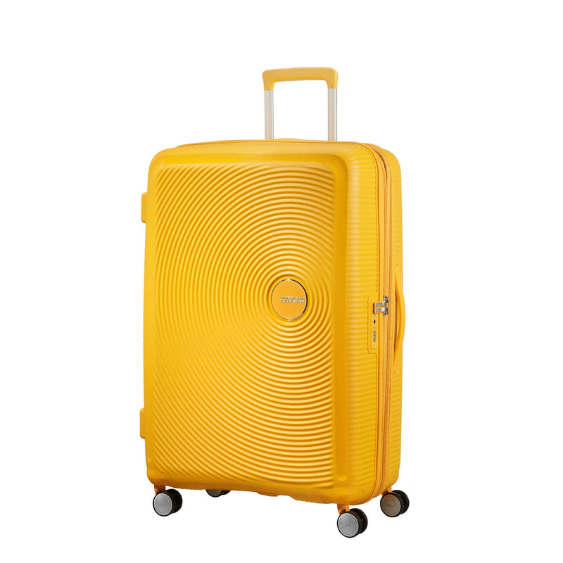 Front of golden yellow American Tourister Large Spinner