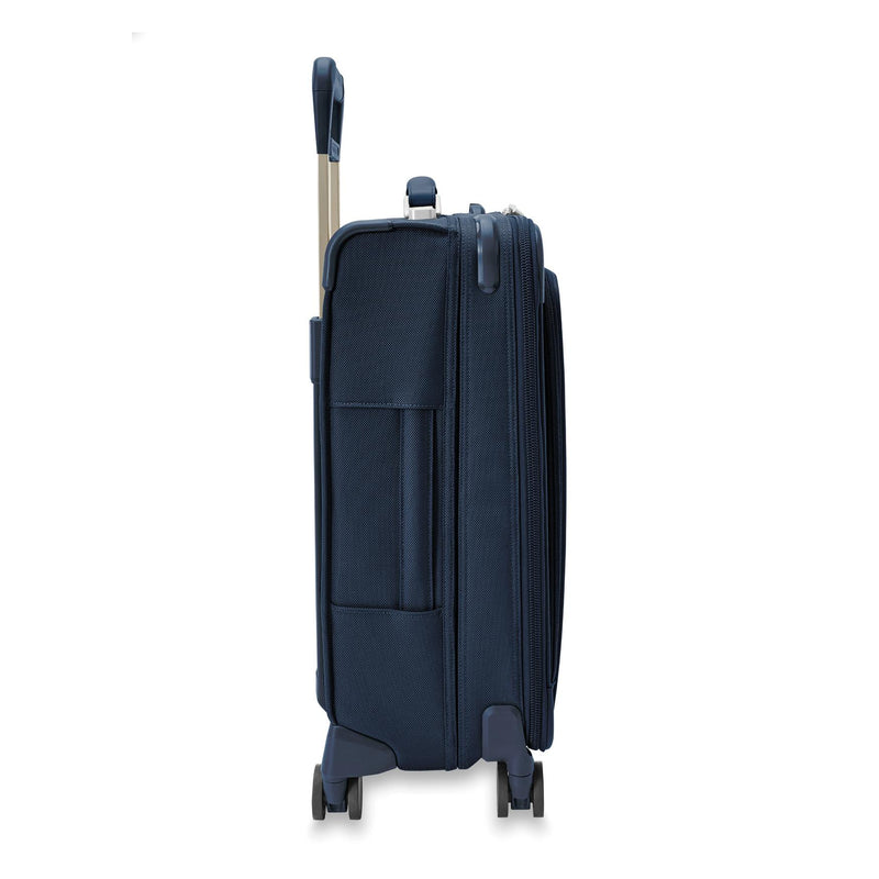 Side of navy Briggs & Riley Baseline Essential Carry-On Spinner