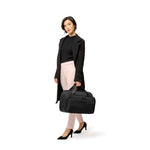 Model with Baseline Expandable Cabin Bag in Black