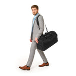 Model with black Briggs & Riley Baseline Garment Duffle