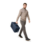 Model with navy Briggs & Riley Baseline Weekender Duffle