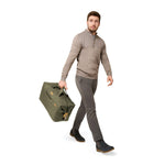 Model with olive Briggs & Riley Baseline Weekender Duffle