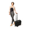 Model with black Briggs & Riley Baseline Wide Carry-On Garment Spinner