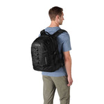 JanSport Odyssey Backpack in Black on model