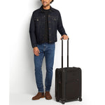 Model with black TUMI Alpha 3 Continental Carry-on Spinner