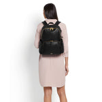 Model with black-gold TUMI Voyageur Ruby Leather Backpack