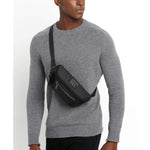 TUMI Bravo Classified Waist Pack in Black on model